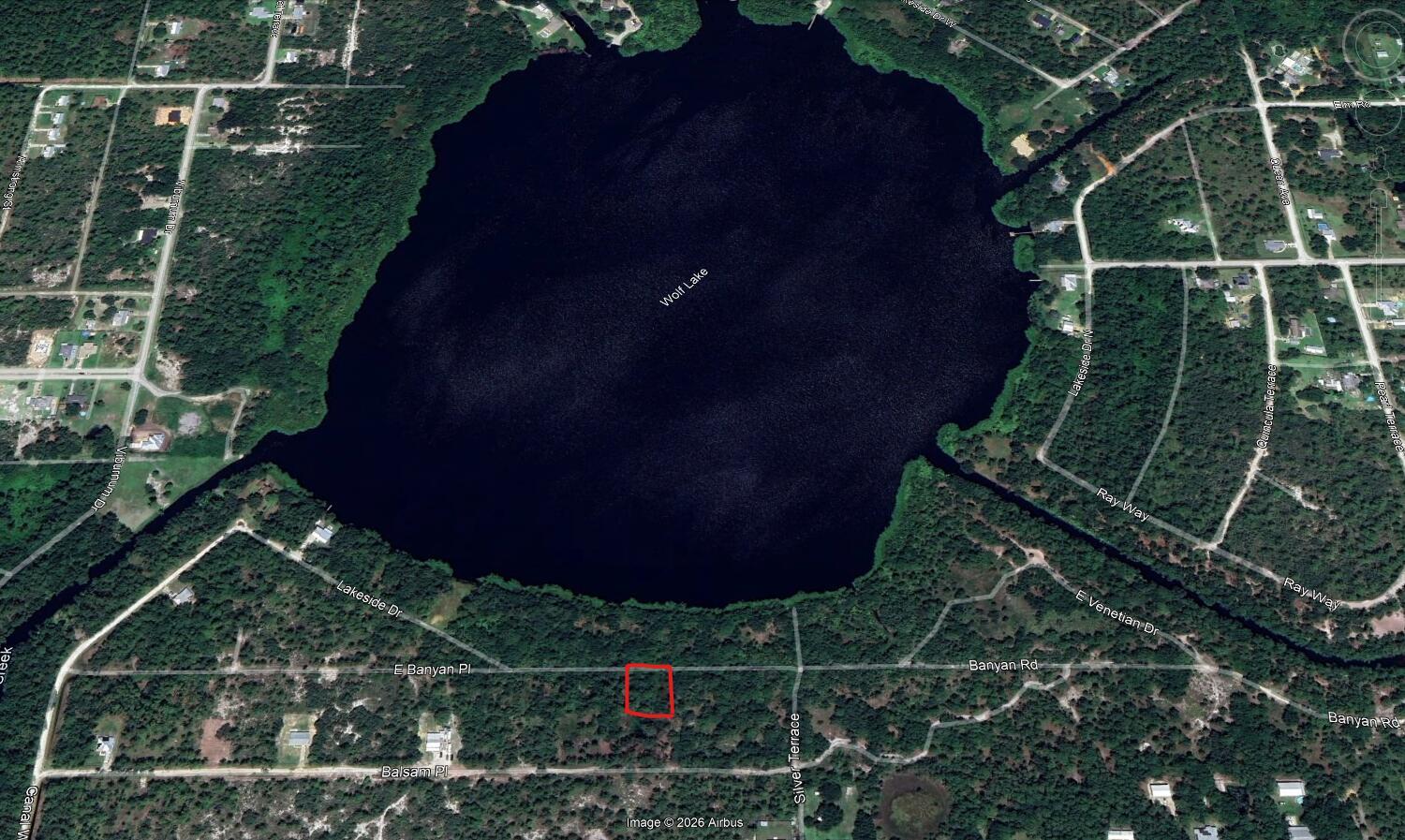 This is an aerial map view of a wooded lot near Wolf Lake — 6512 E Banyan Place, Sebring FL 33875, SEBRING, FL