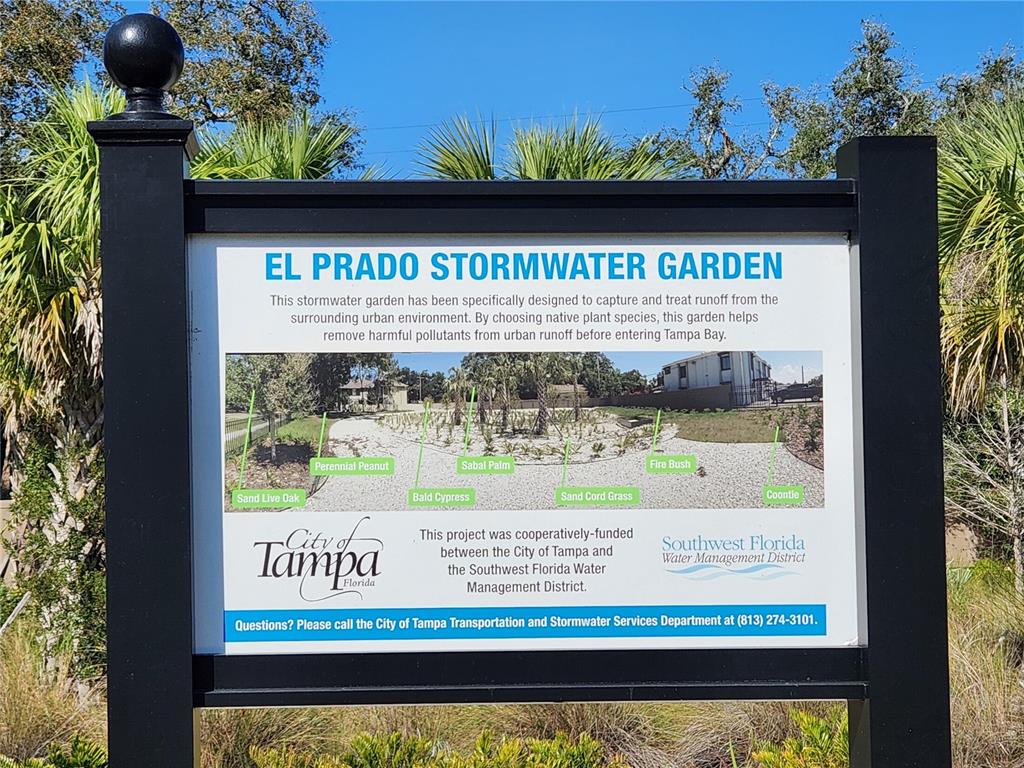A sign for the El Prado Stormwater Garden displays information about the native plant species — 4409 W EL PRADO BOULEVARD, TAMPA, FL
