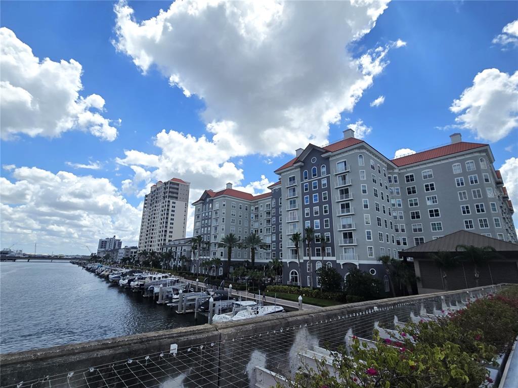 A large multi-story apartment complex sits along a marina with docked boats — 700 S HARBOUR ISLAND BOULEVARD UNIT 646, TAMPA, FL