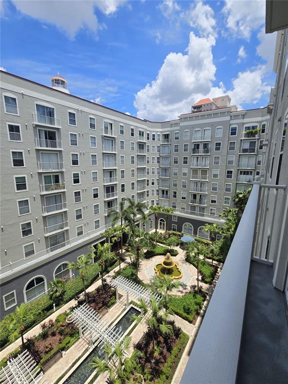 A high-angle view of a courtyard with a fountain surrounded by a large apartment building — 700 S HARBOUR ISLAND BOULEVARD UNIT 646, TAMPA, FL