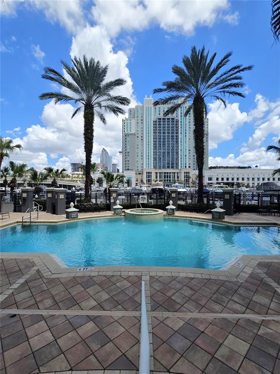 A swimming pool with a hot tub sits on a patio overlooking a large hotel — 700 S HARBOUR ISLAND BOULEVARD UNIT 646, TAMPA, FL