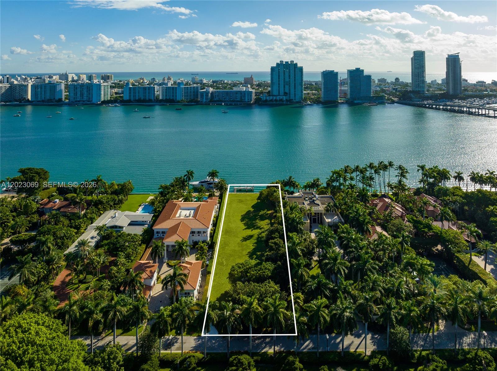An aerial view shows a vacant, rectangular waterfront lot situated between two large residential estates — 36 Star Island Dr, Miami Beach FL 33139, MIAMI BEACH, FL