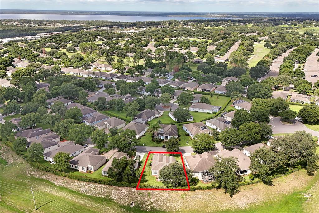 An aerial view shows a single-family house outlined in red within a suburban neighborhood — 4075 KINGSLEY STREET, CLERMONT, FL