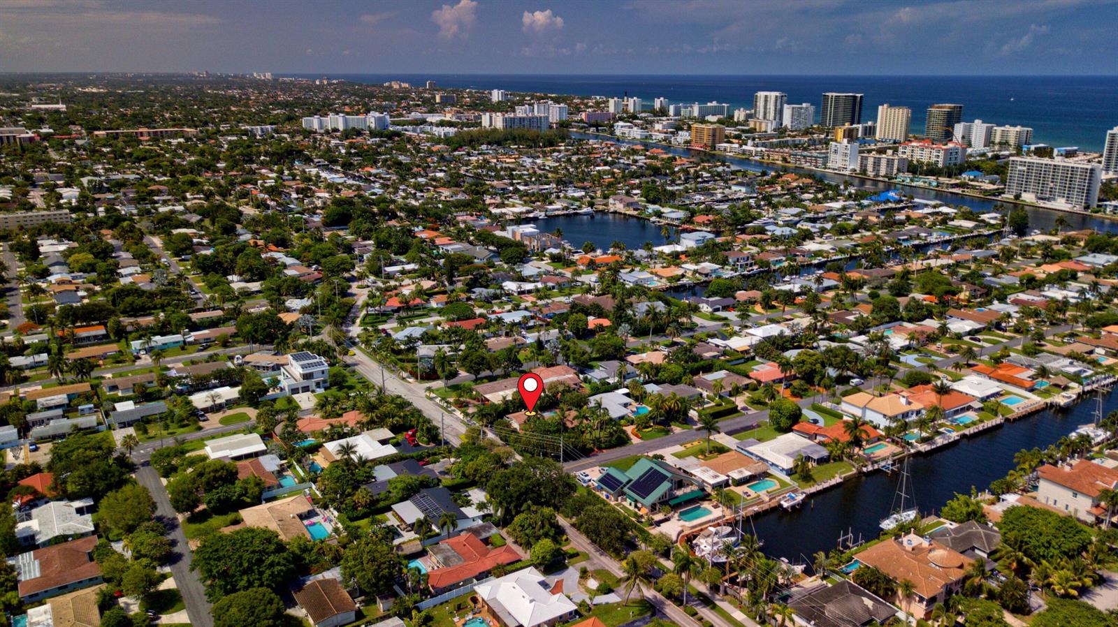 An aerial view of a residential neighborhood with a red pin marking a specific house — 700 NE 26th Avenue, Pompano Beach FL 33062, POMPANO BEACH, FL