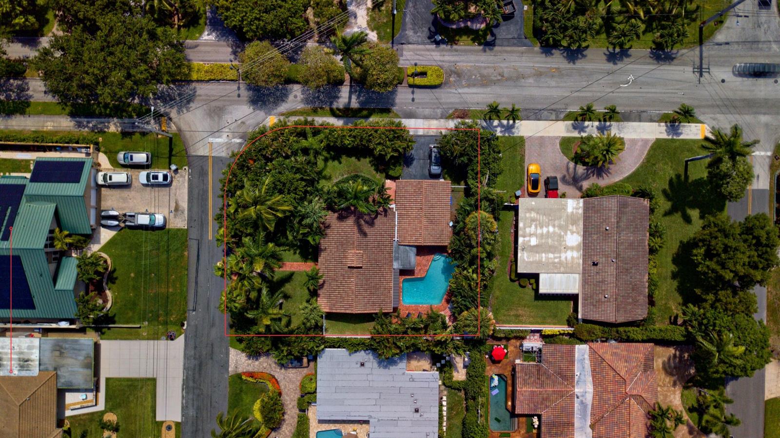 An aerial view shows a house with a tiled roof and a backyard swimming pool — 700 NE 26th Avenue, Pompano Beach FL 33062, POMPANO BEACH, FL