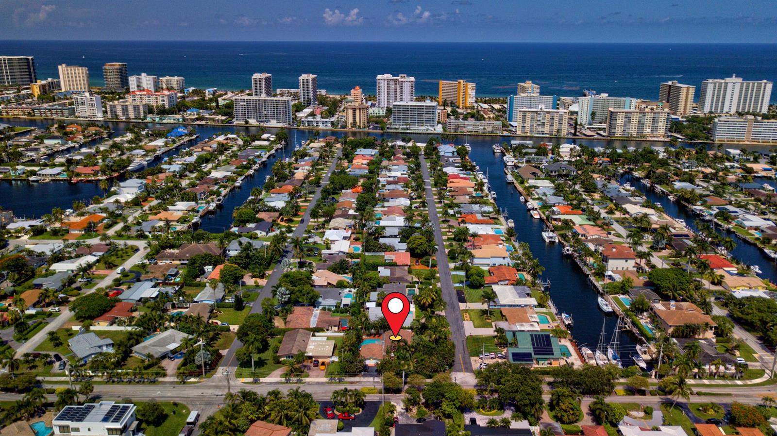 An aerial view shows a residential neighborhood with canals, palm trees, and a red location pin — 700 NE 26th Avenue, Pompano Beach FL 33062, POMPANO BEACH, FL