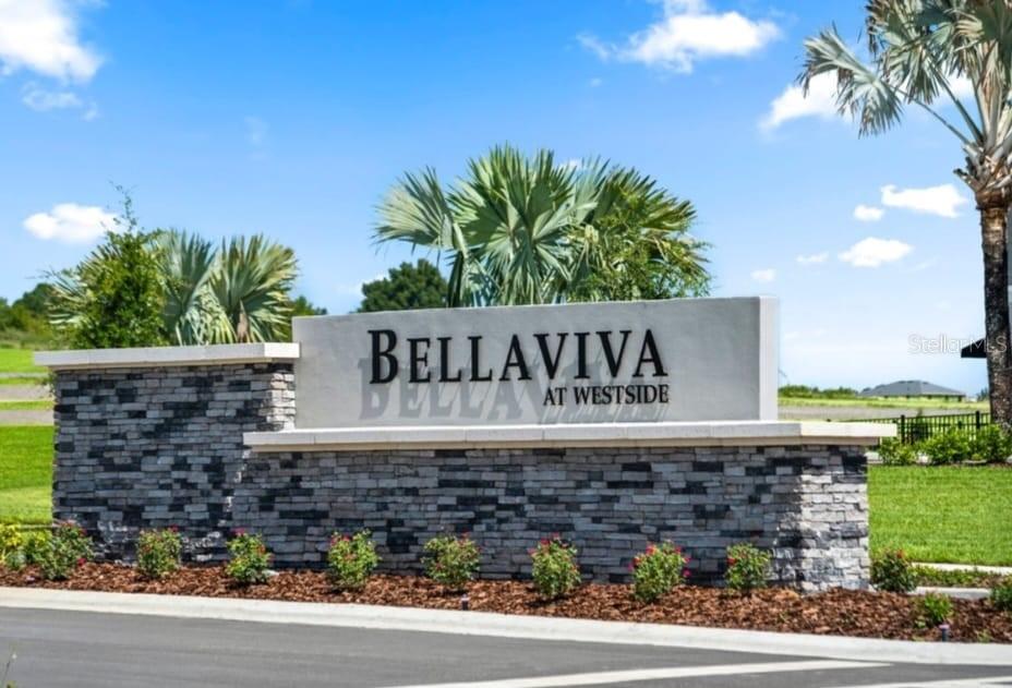 A stone-based monument sign for Bellaviva at Westside stands in a landscaped outdoor area — 9377 WESTSIDE HILLS DRIVE, DAVENPORT, FL