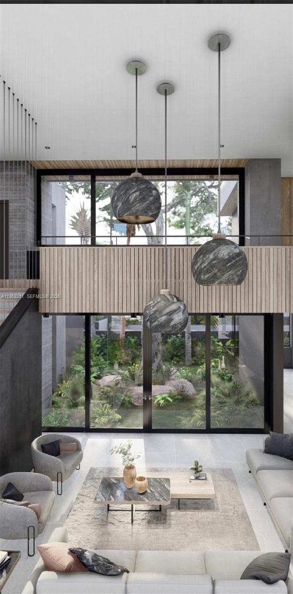 This rendering shows a modern living room with double-height ceilings, marble pendant lights, and floor-to-ceiling windows — 2664 SW 17th Ave, Miami FL 33133, MIAMI, FL