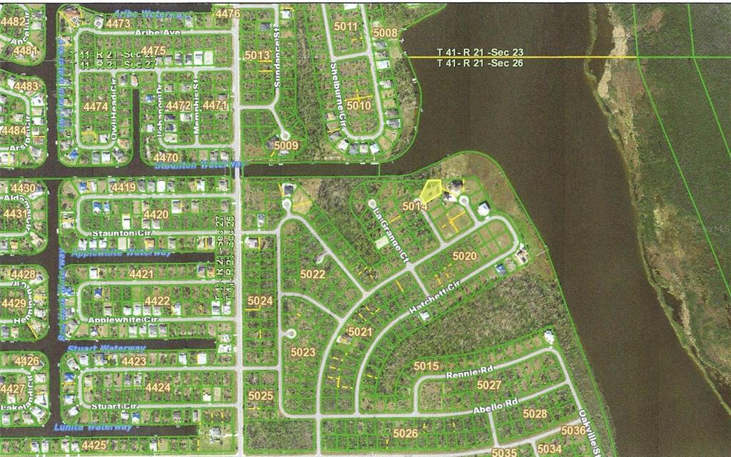 This is an aerial map showing residential lots, streets, and waterways in a suburban neighborhood — 10118 NEAL COURT, PORT CHARLOTTE, FL