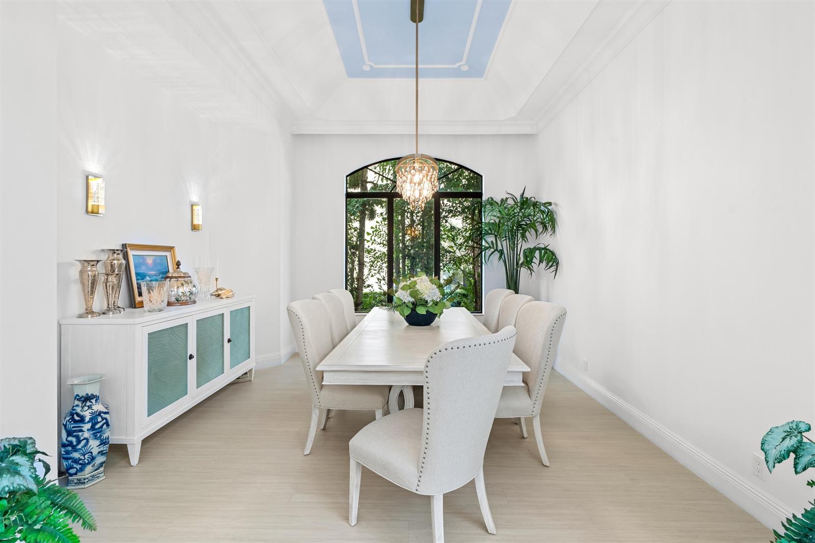 A dining room features a white table, upholstered chairs, a sideboard, and a blue ceiling — 17894 Monte Vista Drive, Boca Raton FL 33496, BOCA RATON, FL