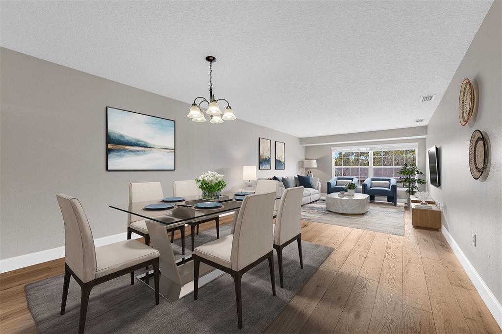 An open-concept dining and living area features light wood floors, neutral walls, and modern furniture — 110 N TREMAIN STREET UNIT 209, MOUNT DORA, FL