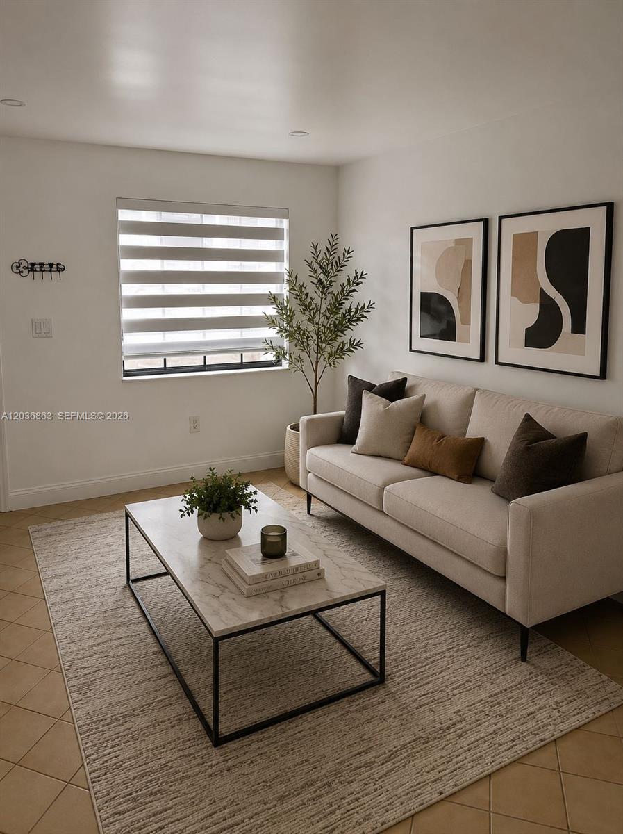 A living room features a beige sofa, a marble coffee table, and two framed abstract prints — 13335 SW 57th Ter # 3, Miami FL 33183, MIAMI, FL