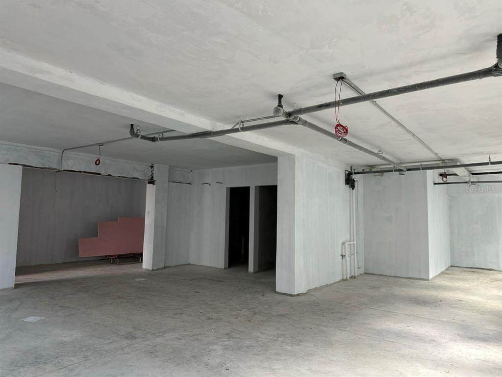 An unfinished commercial space with exposed pipes, concrete floors, and white-painted walls — 656 RH TODD UNIT 1, SAN JUAN, PR