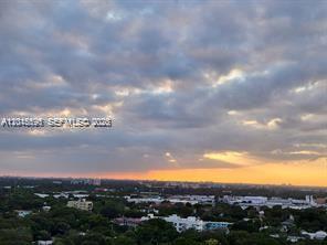 An elevated view of a suburban landscape under a cloudy sunset sky — 780 NE 69th St # 1810, Miami FL 33138, MIAMI, FL