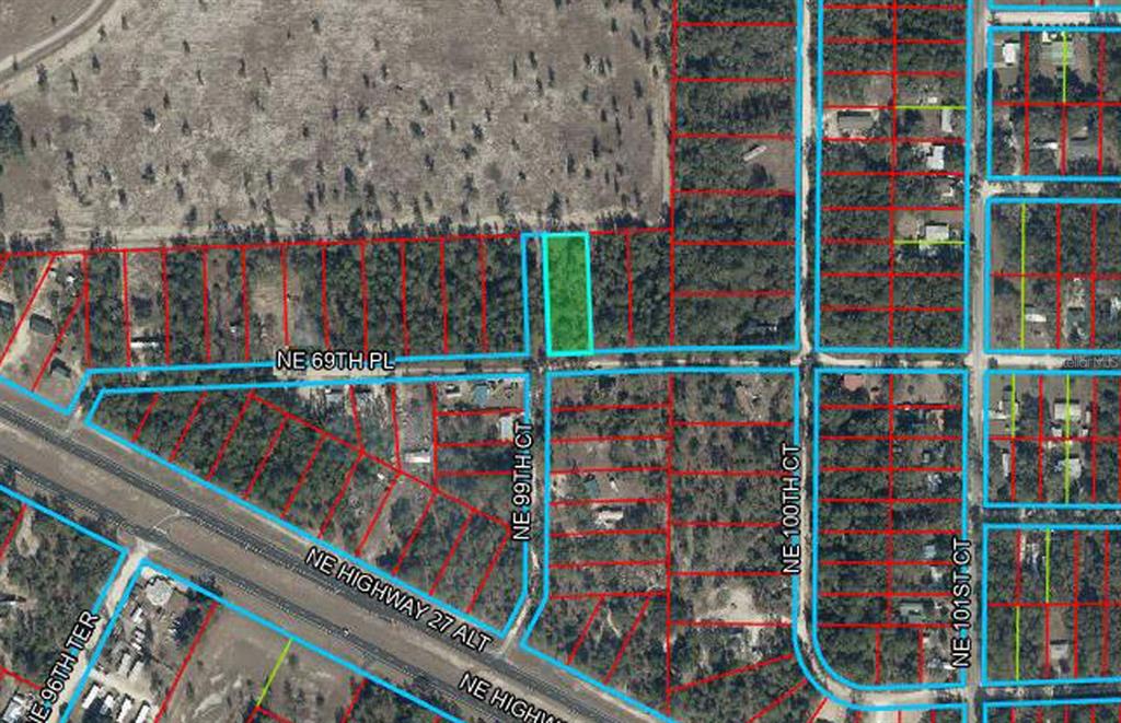 This is an aerial map showing a highlighted vacant lot located at a street intersection — TBD NE 69TH PLACE, BRONSON, FL
