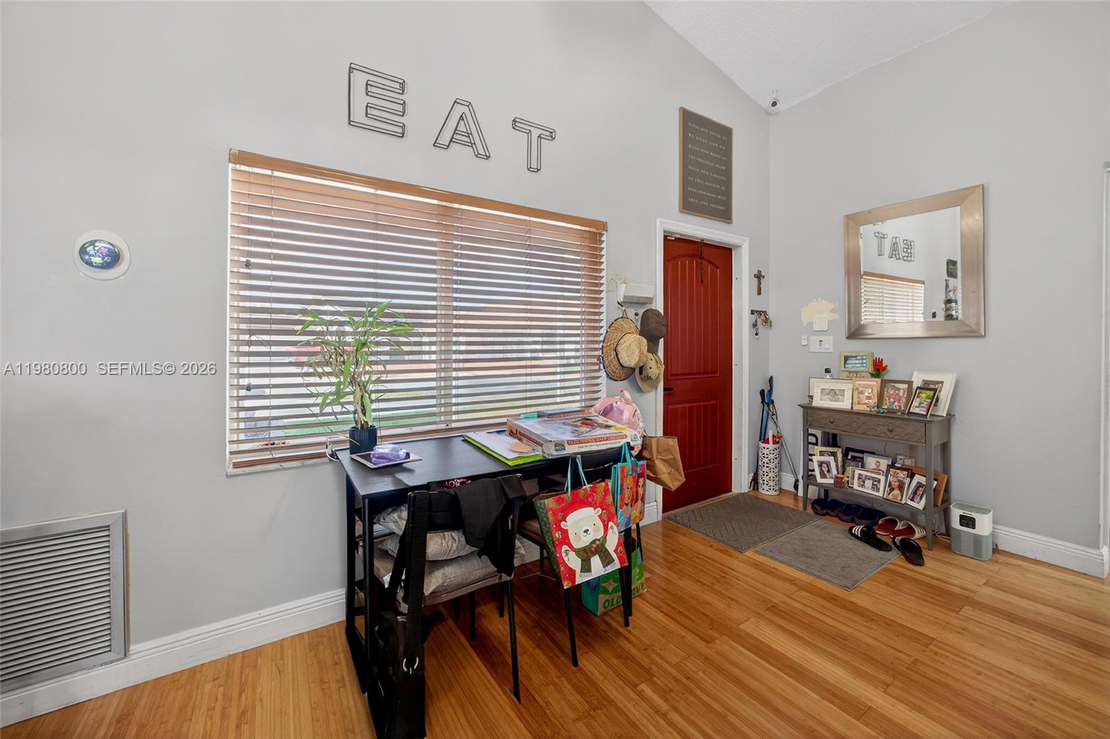 A room with light gray walls, wood flooring, a window with blinds, and a desk — 15260 SW 57th St, Miami FL 33193, MIAMI, FL