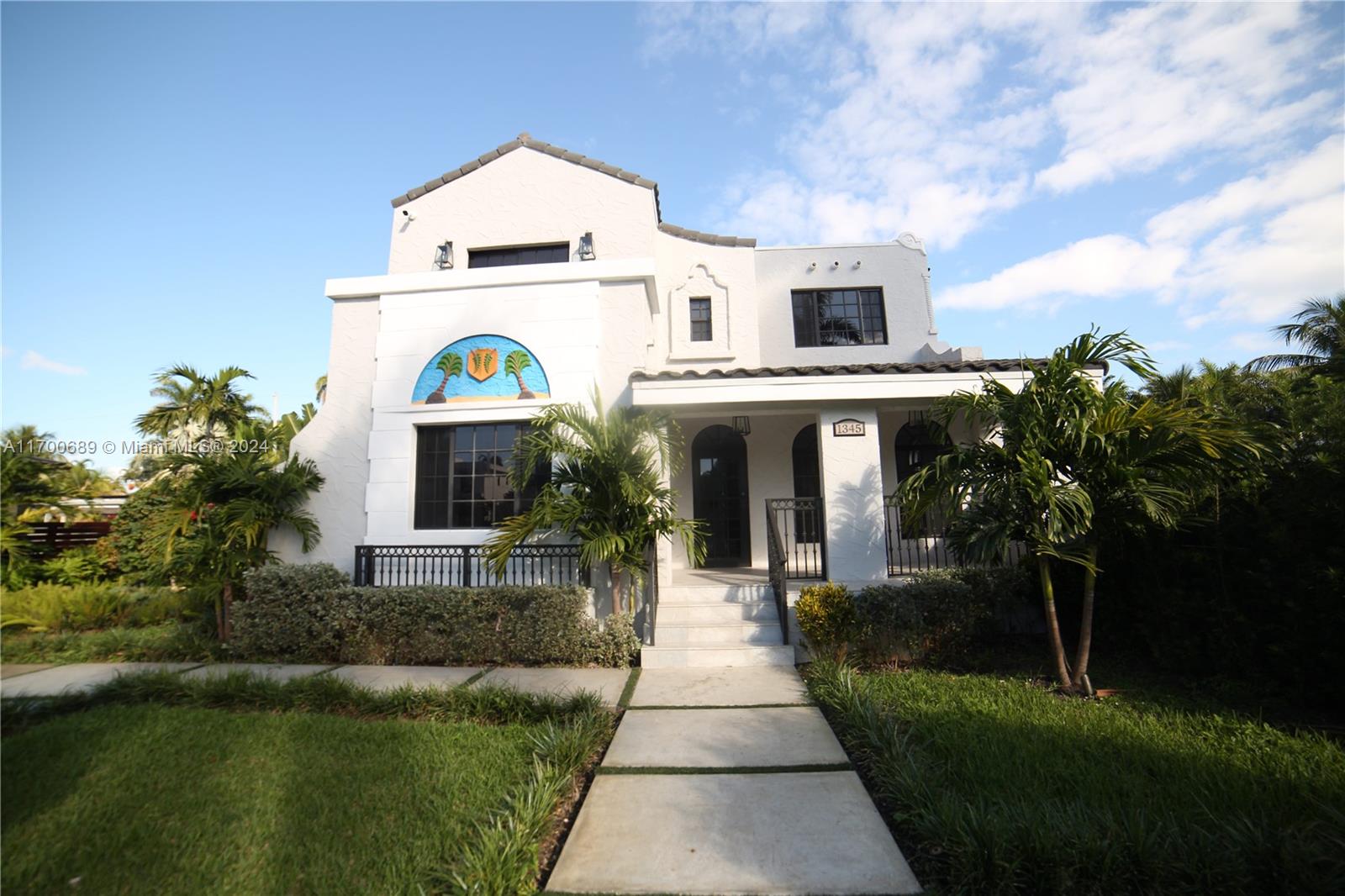 A two-story white stucco house features a decorative arched mural and a front porch — 1345 Hollywood Blvd, Hollywood FL 33019, HOLLYWOOD, FL