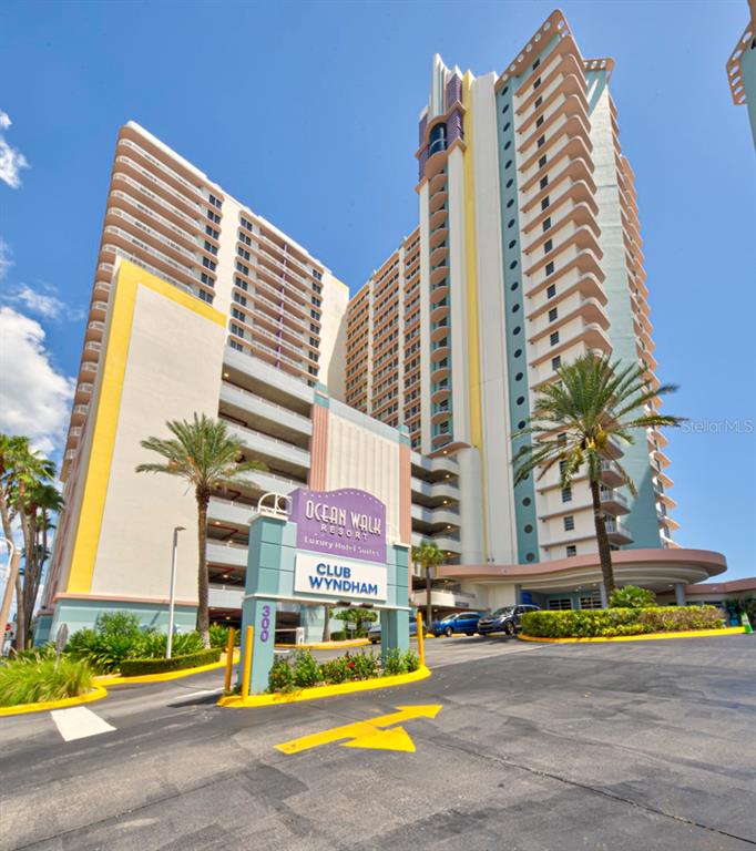 A low-angle exterior view of the Ocean Walk Resort high-rise building with a prominent sign — 350 N ATLANTIC AVENUE UNIT 2328, DAYTONA BEACH, FL