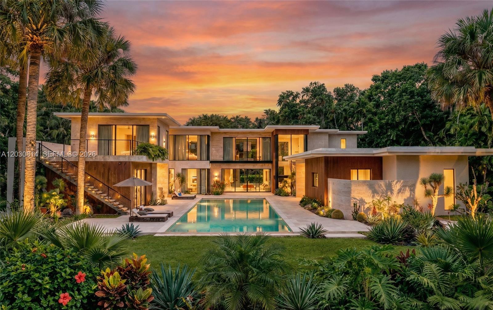 A modern two-story luxury home with a swimming pool and lush tropical landscaping at sunset — 6100 W Suburban Dr, Pinecrest FL 33156, PINECREST, FL