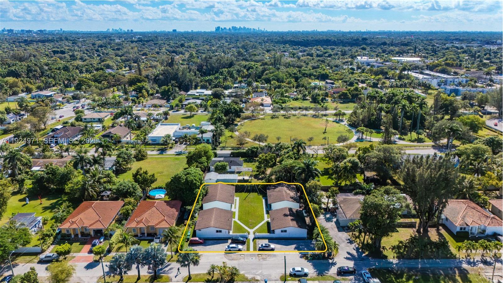 An aerial view shows a residential duplex with a shared lawn and parking area — 60 NW 161st St, Miami FL 33169, MIAMI, FL