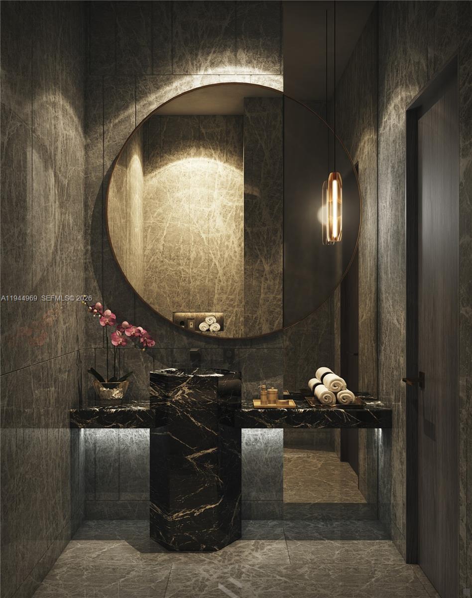 This rendering shows a modern powder room with dark marble walls, a pedestal sink, and mirror — 249 NE 3 ST # 6101, Miami FL 33132, MIAMI, FL