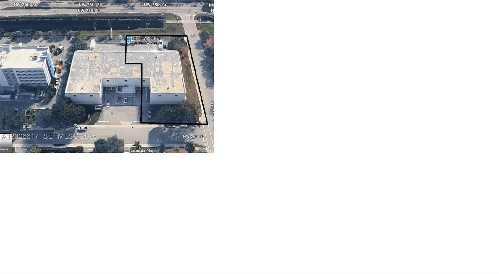 This is an aerial map view of a commercial building with a surrounding property boundary — 8975 NW 26th St, Doral FL 33172, DORAL, FL
