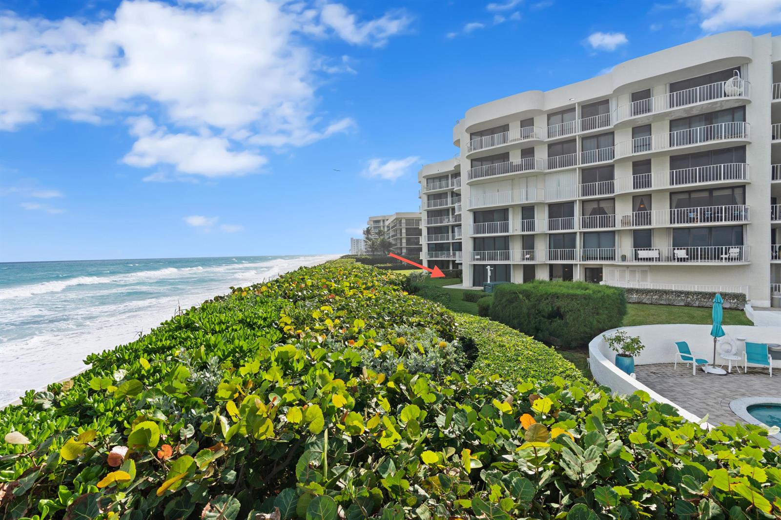 A multi-story white residential building sits along a beach with a lush green hedge — 3360 S Ocean Boulevard, Palm Beach FL 33480, PALM BEACH, FL