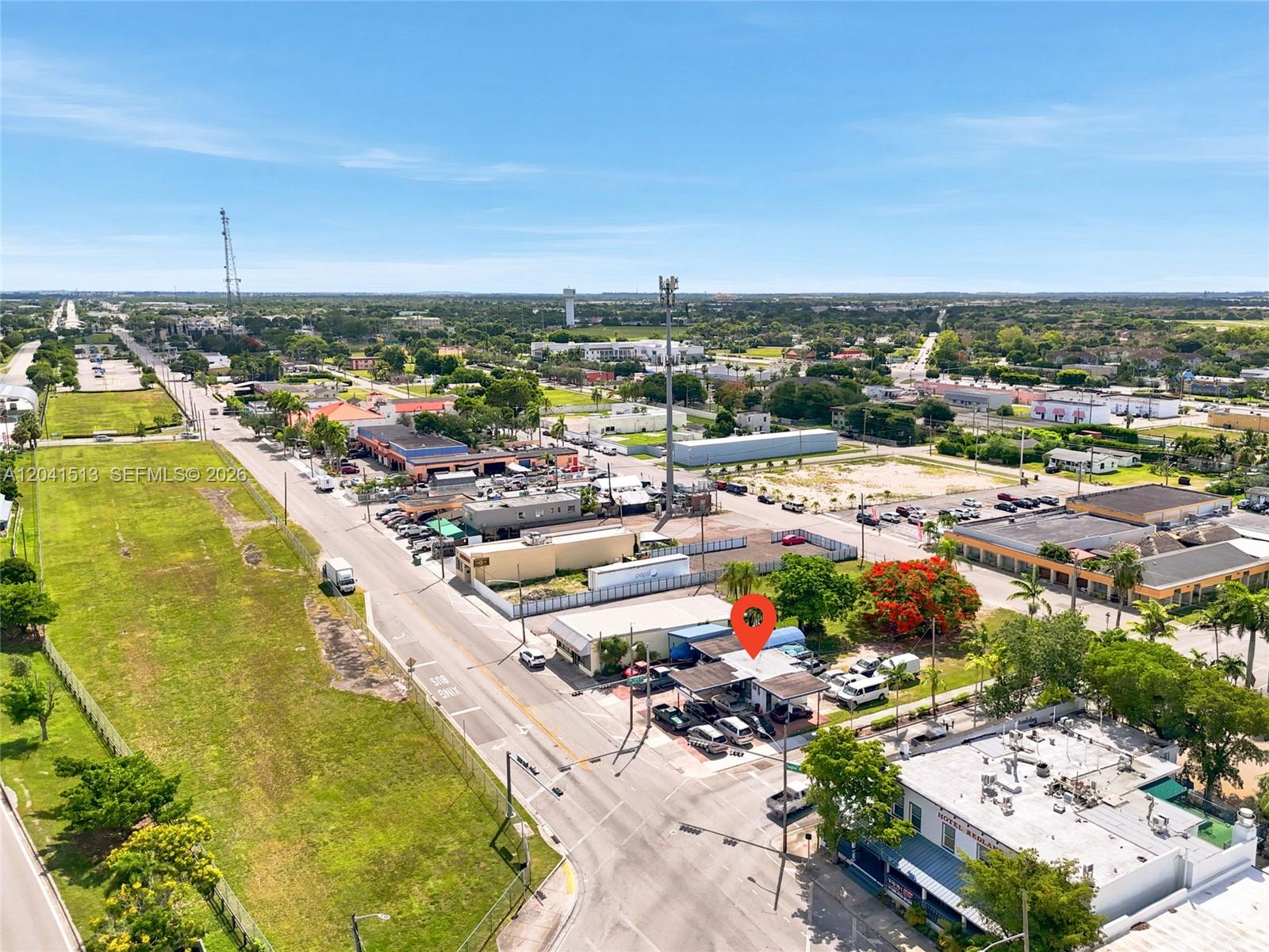 An aerial view shows a commercial building with a red location pin and parking lot — 3 N Flagler Ave, Homestead FL 33030, HOMESTEAD, FL