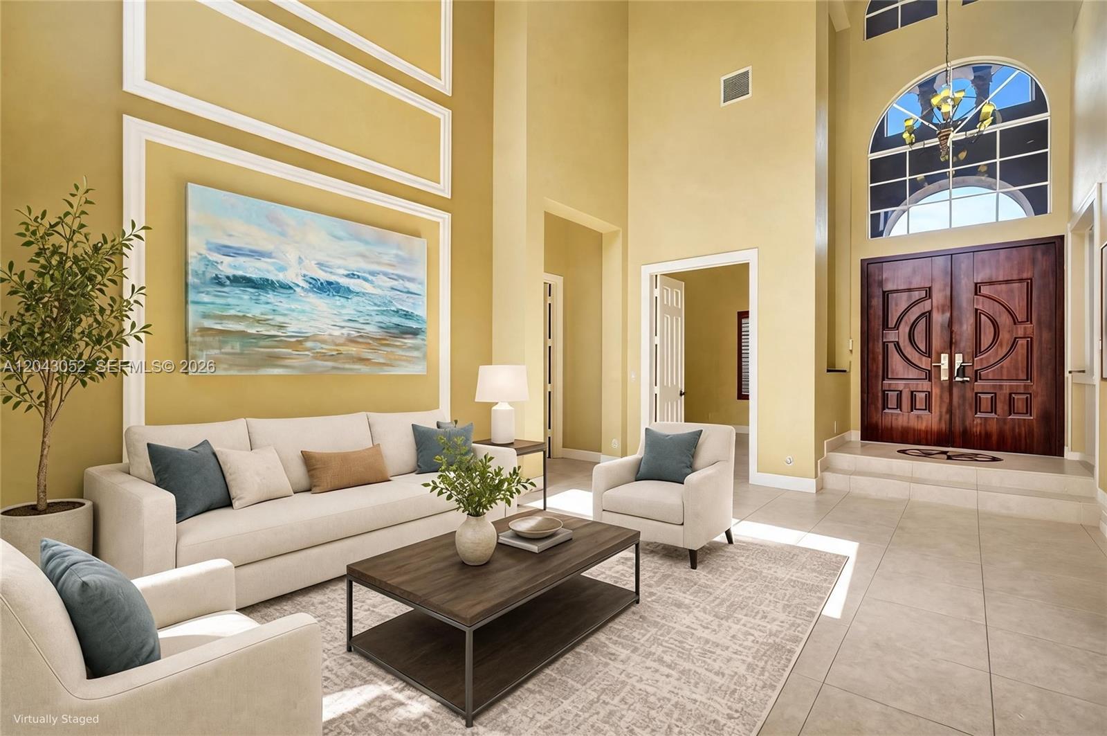 A living room with high ceilings, tile floors, and a large arched window above double doors — 9316 Pearch Ln, Boynton Beach FL 33437, BOYNTON BEACH, FL