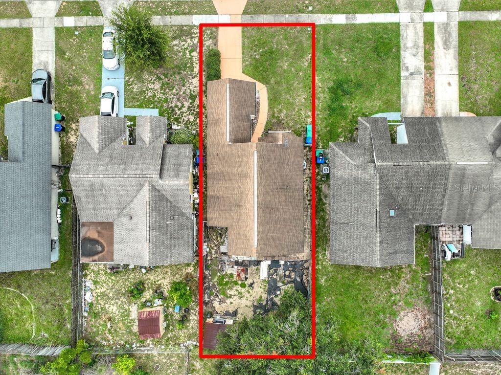 An aerial view shows a house with a brown roof centered on a rectangular lot — 3549 SPRING LAND DRIVE, ORLANDO, FL