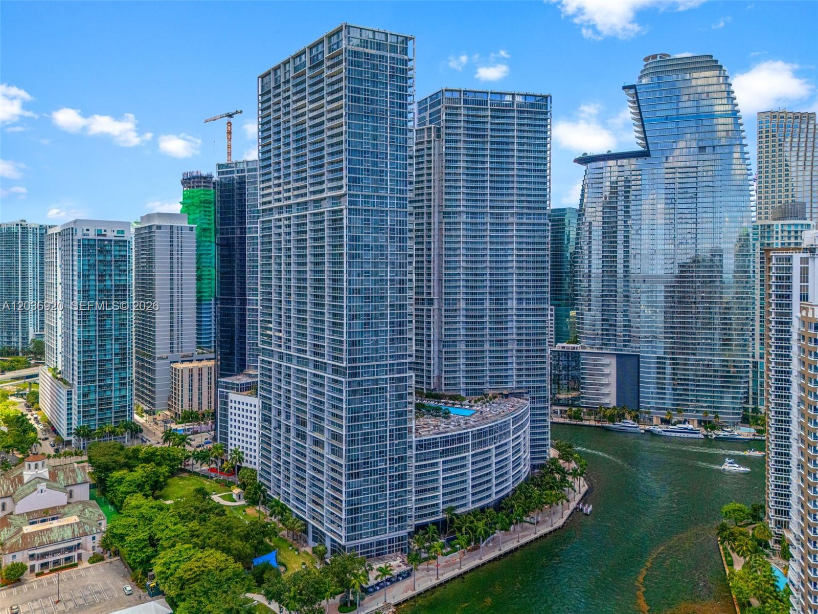 An aerial view of modern glass skyscrapers situated along a canal in a city — 495 Brickell Ave # 905, Miami FL 33131, MIAMI, FL