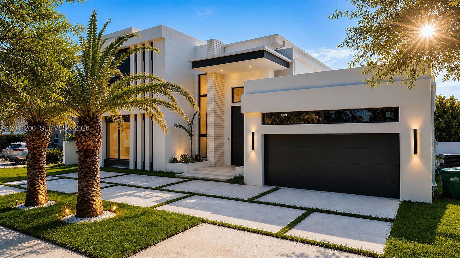 A modern two-story house features a white stucco exterior, a dark garage door, and palm trees — 16022 NW 83rd Ct, Miami Lakes FL 33016, MIAMI LAKES, FL