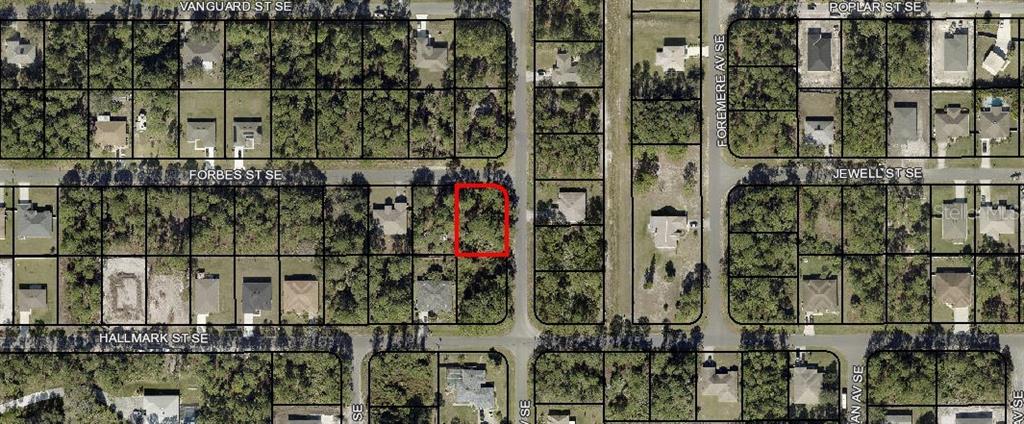 This is an aerial map showing a vacant lot outlined in red within a residential neighborhood — 00 FORBES STREET SE, PALM BAY, FL