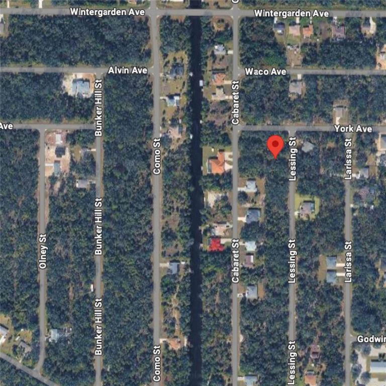 This is an aerial map view of a residential neighborhood with a red location pin — 3081 LESSING STREET, PORT CHARLOTTE, FL