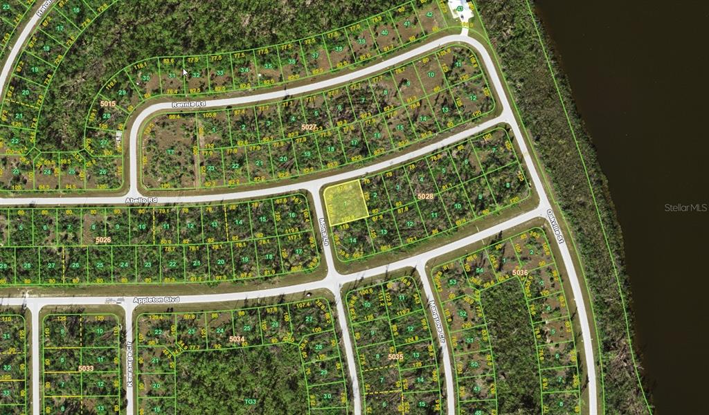 This is a satellite map showing residential lots, streets, and undeveloped land — 10468 MONA LANE, PORT CHARLOTTE, FL