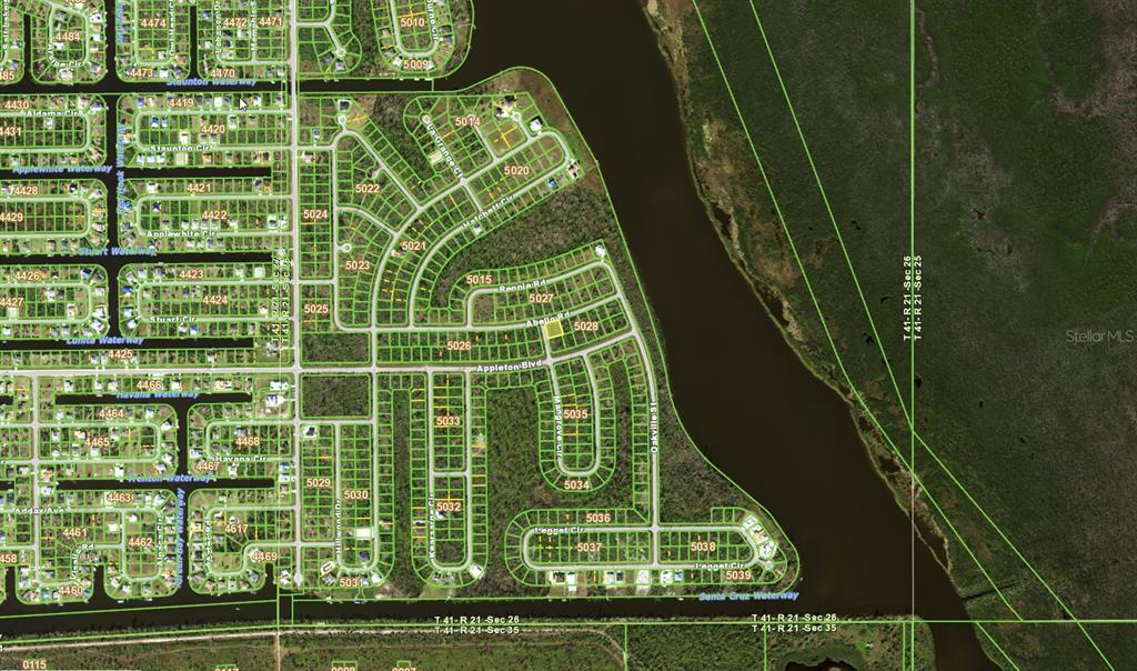 This is an aerial map showing a residential neighborhood with streets and a large waterway — 10468 MONA LANE, PORT CHARLOTTE, FL