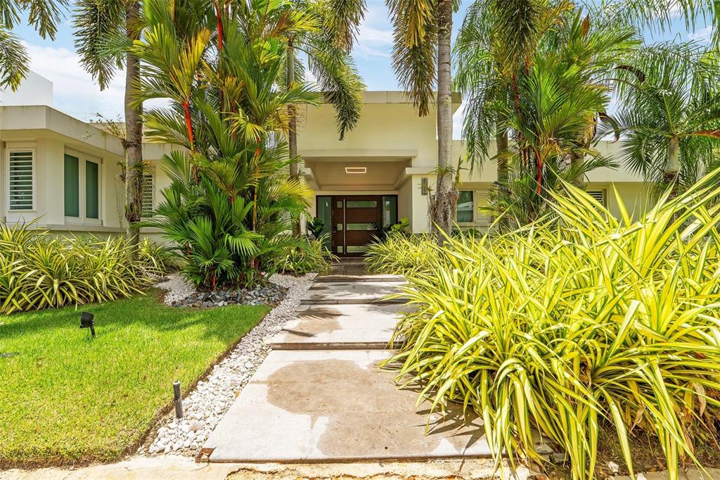 An aerial view shows a house with a flat roof, swimming pool, and tennis court — 154 CALLE VIOLETA, SAN JUAN, PR