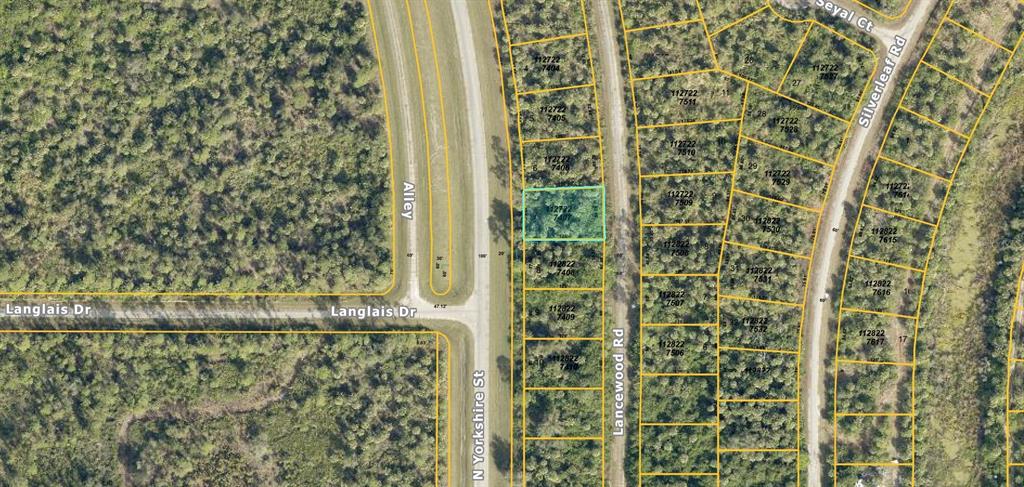 This is an aerial map showing a highlighted vacant lot along a paved road — Lot 7 LANCEWOOD ROAD, NORTH PORT, FL