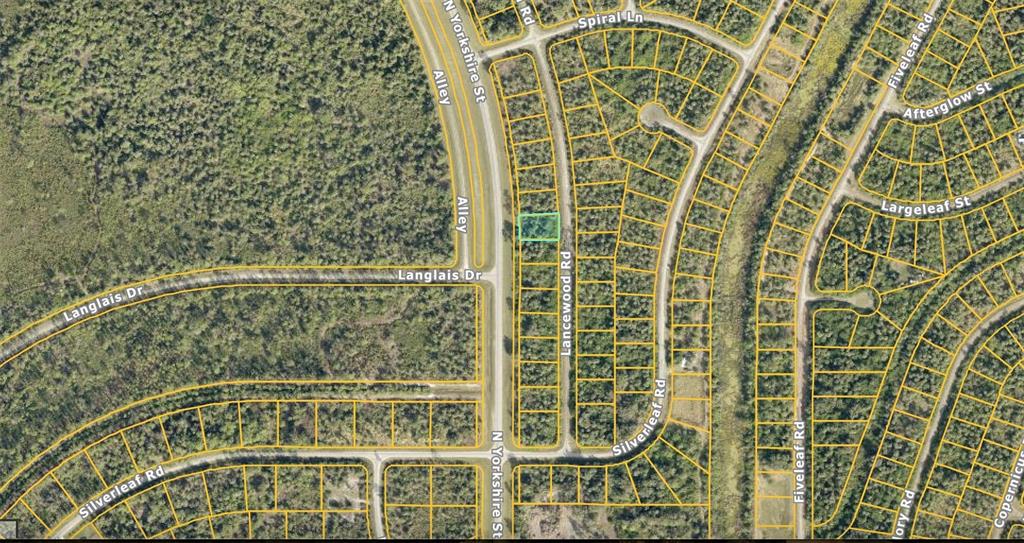 This is an aerial map showing a highlighted vacant residential lot in a wooded neighborhood — Lot 7 LANCEWOOD ROAD, NORTH PORT, FL
