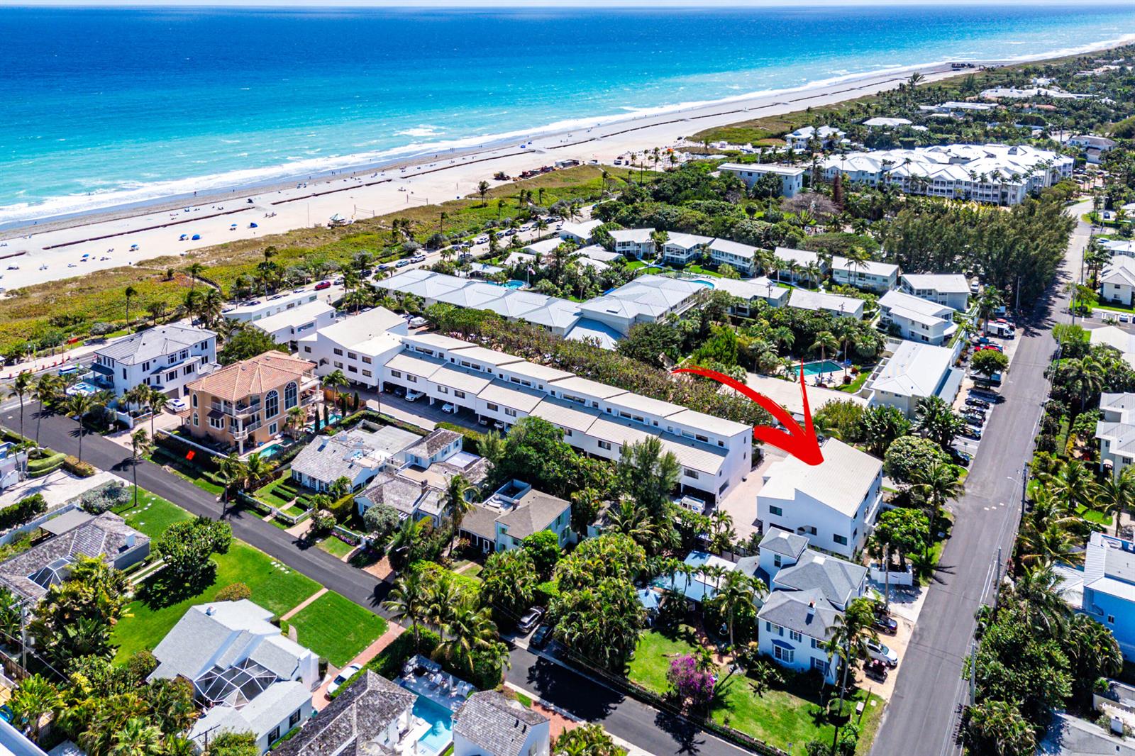 An aerial view shows a multi-story white building with a red arrow pointing toward it — 250 S Ocean Boulevard # 279, Delray Beach FL 33483, DELRAY BEACH, FL