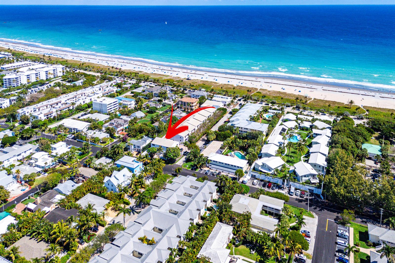 An aerial view shows a multi-story residential building highlighted by a red arrow near the beach — 250 S Ocean Boulevard # 279, Delray Beach FL 33483, DELRAY BEACH, FL