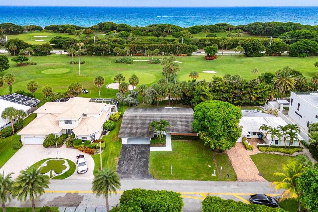 An aerial view of a residential street with houses bordering a golf course and ocean — 900 Marble Way, Boca Raton FL 33432, BOCA RATON, FL