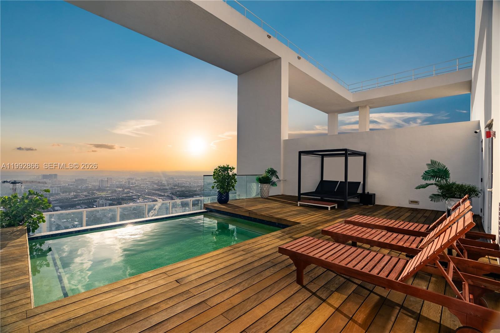 A rooftop terrace features a wooden deck, a small pool, lounge chairs, and city views — 1040 Biscayne Blvd # 4607, Miami FL 33132, MIAMI, FL