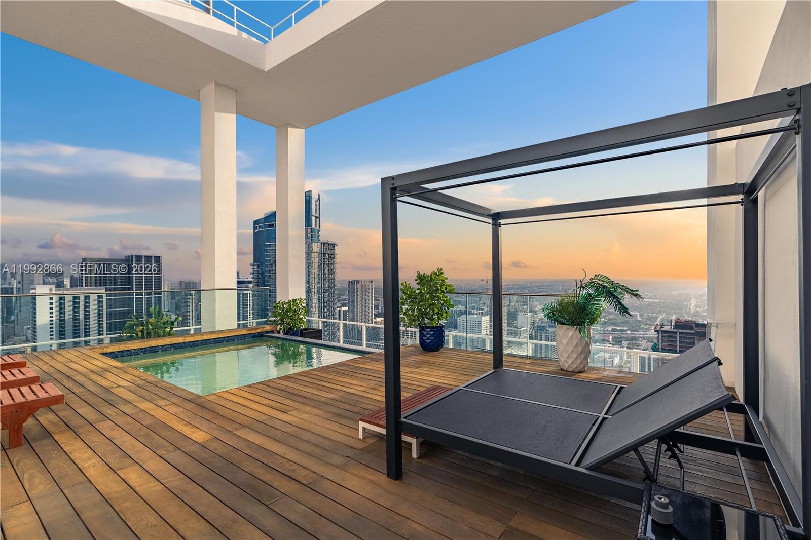 A rooftop terrace features a small pool, wooden decking, and a shaded lounge area — 1040 Biscayne Blvd # 4607, Miami FL 33132, MIAMI, FL