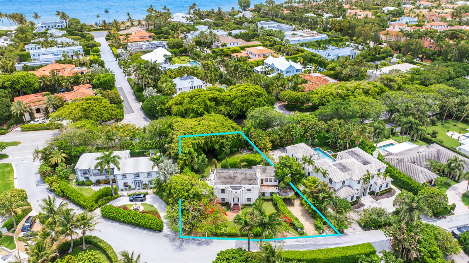 An aerial view shows a white two-story house surrounded by lush trees and landscaping — 357 Crescent Drive, Palm Beach FL 33480, PALM BEACH, FL
