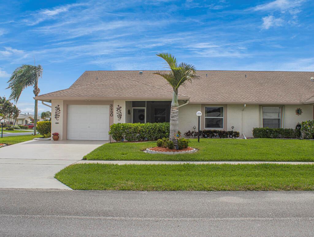 A single-story house with a white garage, a palm tree, and a green lawn — 3290 Belleville Road # 3290, West Palm Beach FL 33417, WEST PALM BEACH, FL