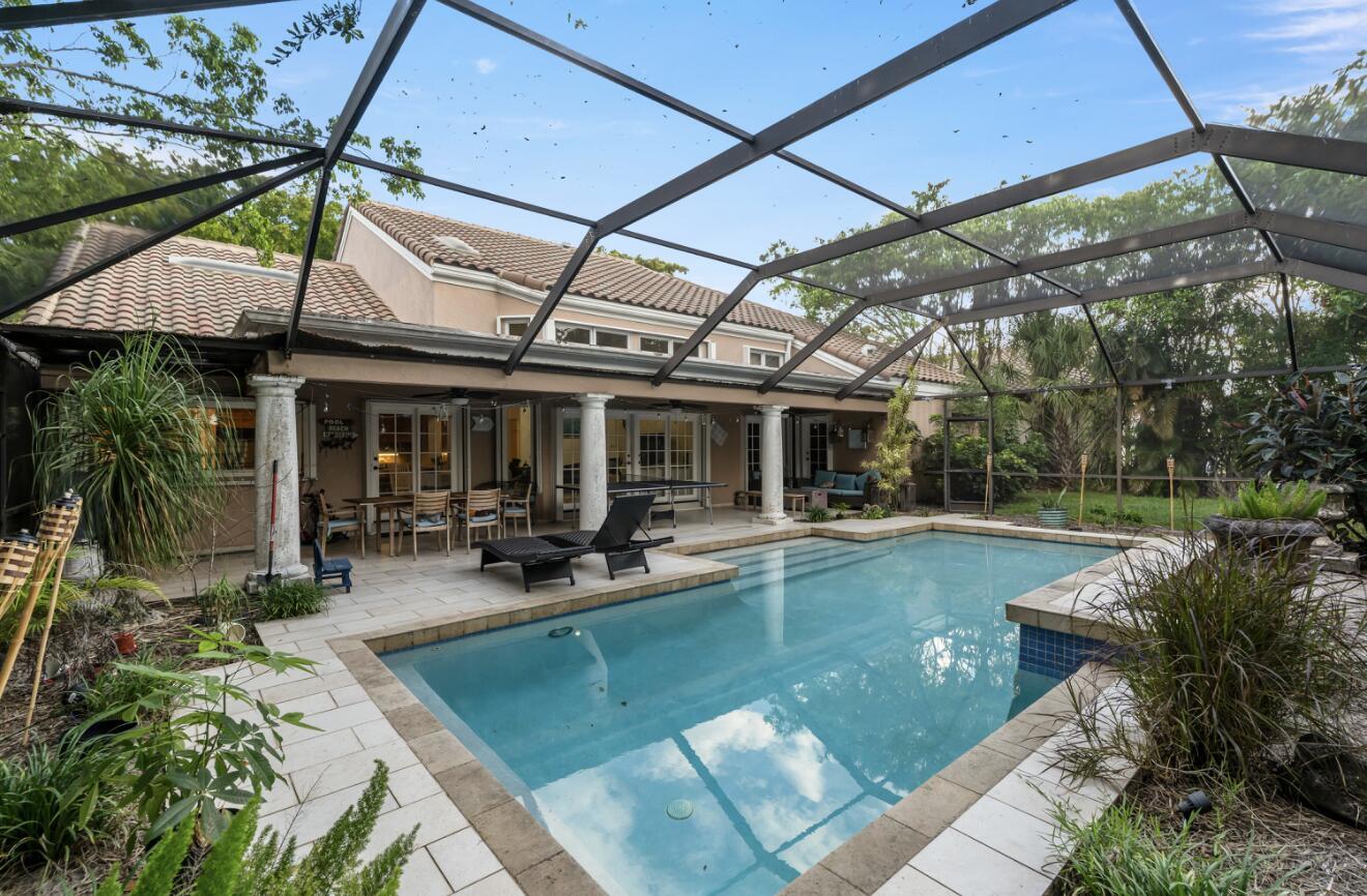 A two-story suburban house with a tiled roof, palm trees, and a front driveway — 2683 NW 49th Street, Boca Raton FL 33434, BOCA RATON, FL