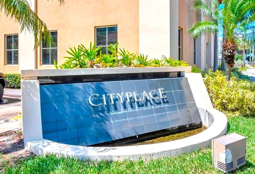 A stone monument sign with the name CityPlace sits in front of a tan building — 1550 W CLEVELAND STREET UNIT 11, TAMPA, FL