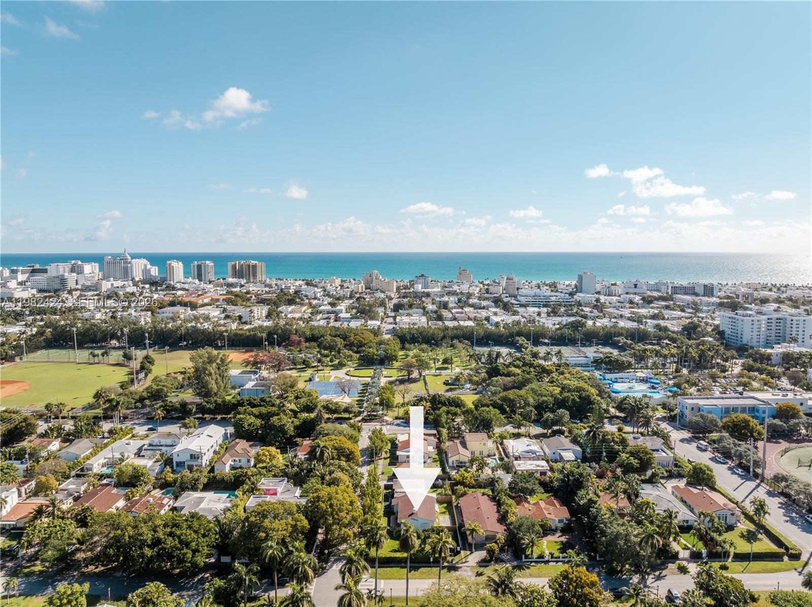 An aerial view shows a residential neighborhood with a white arrow pointing to a house — 1255 Lenox Ave, Miami Beach FL 33139, MIAMI BEACH, FL