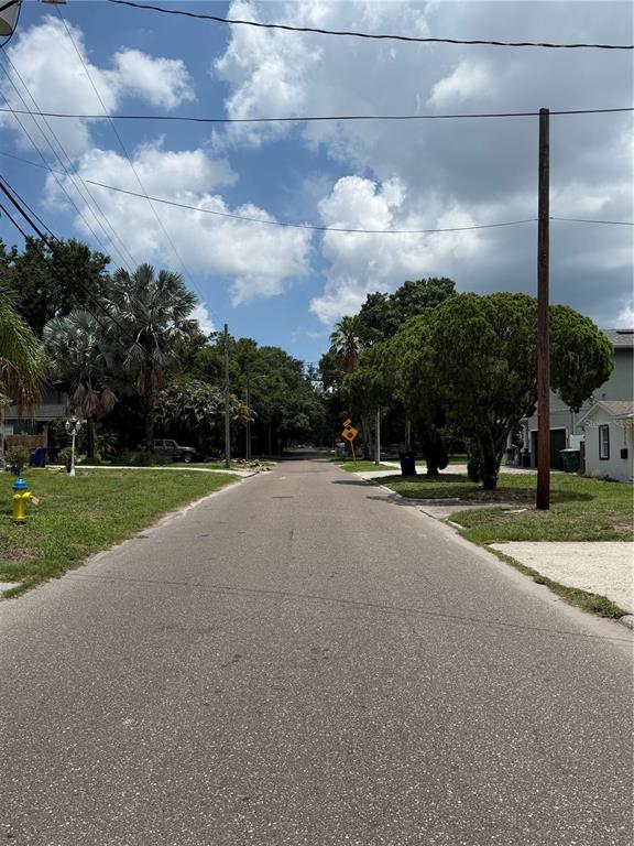 A paved residential street lined with trees, a fire hydrant, and utility poles — 2711 N MYRTLE AVENUE, TAMPA, FL